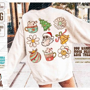May include: White sweatshirt featuring various Christmas-themed graphics, including a Christmas tree, Santa Claus, and a smiling flower. The design includes the text "YOU WANNA MORE DESIGN LIKE THIS?" and "PANDACREATIVE.ORG visit our website :) ".