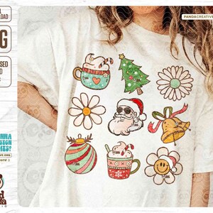 May include: White t-shirt featuring a collection of Christmas-themed graphics. Designs include a Christmas tree, Santa Claus, mugs of hot chocolate, flowers, and a bell. The shirt also has the text "DIGITAL DOWNLOAD PNG DISTRESSED & SOLID PNGS".