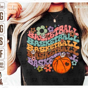 May include: A black t-shirt with a rainbow-colored design of the word "basketball" repeated multiple times. The design includes flowers and a basketball with a heart on it.