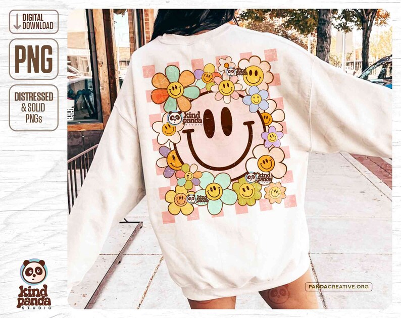 May include: Cream sweatshirt with a large smiley face and floral design. The back has a checkered pattern and the words "kind panda studio". The design includes the text "digital download" and "distressed & solid PNGs". The design is in a retro style.