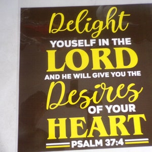 May include: A brown background with white and yellow text that reads "Delight yourself in the Lord and he will give you the desires of your heart - Psalm 37:4".