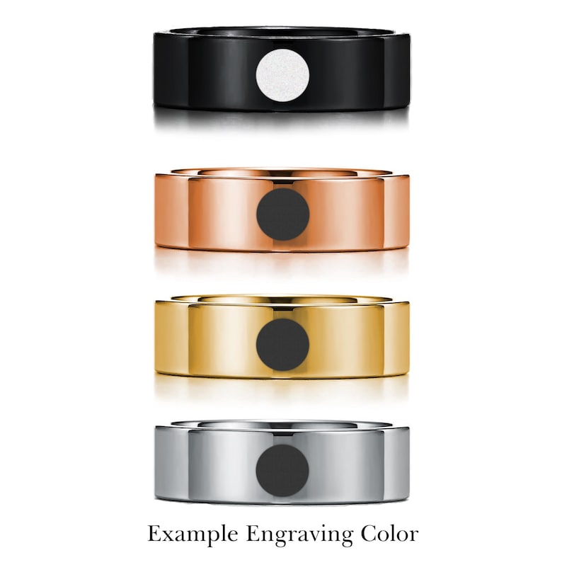 May include: Four different colored rings with a black circle in the center. The rings are black, rose gold, gold, and silver. Example Engraving Color.