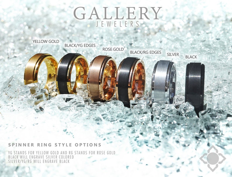 May include: Six different styles of spinner rings with various metal finishes. The rings are arranged from left to right: yellow gold, black with yellow gold edges, rose gold, black with rose gold edges, silver, and black. The rings are displayed on a bed of crushed ice.