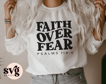 May include: White sweatshirt with black text that reads "FAITH OVER FEAR PSALMS 118:6".