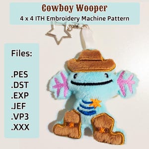 May include: A blue and brown plush toy of a cowboy Wooper, a Pokemon character, wearing a brown cowboy hat and boots. The toy is 4 inches by 4 inches and comes with embroidery machine files in PES, DST, EXP, JEF, VP3, and XXX formats.
