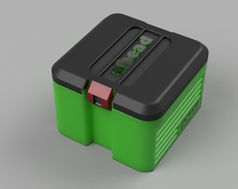 May include: A green and black storage box with the word "ahead" printed on the lid. The box has a red latch.