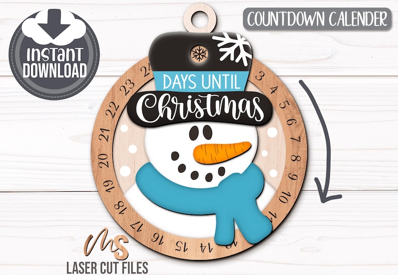 SVG Laser Cut Files for a Christmas Countdown Snowman Ornament featuring a cute snowman wearing a scarf and top hat adorned with a snowflake. His scarf covers a round turning wheel with 25 numbered days until Christmas, and his hat provides a window at the top to show how many days you have left! Turn the wheel each day until you reach the snowflake on Christmas morning!