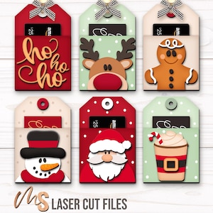 SVG Laser Cut Files for a bundle of 6 Christmas Gift Card Holders featuring cute Gift Tag shapes decorated with a Santa Claus, the text Ho Ho Ho, a Snowman, a Gingerbread Man, a Reindeer, and a Christmas Coffee Cup with spacers on the inside where you can insert your Gift Cards and money! Create festive Gift Card Holders, Money Holders, and gift Ornaments!