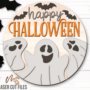 SVG files for a round wood Halloween Sign with three spooky ghosts peaking up from the bottom with the phrase Happy Halloween in decorative fonts and bats flying overhead. Perfect for making spooky Halloween Door Hangers, Ghost Signs, and Halloween decor this fall season!
