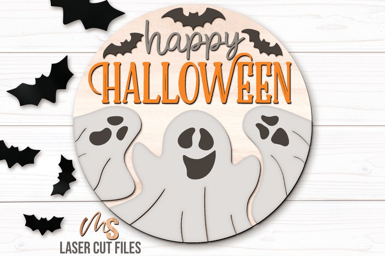 SVG files for a round wood Halloween Sign with three spooky ghosts peaking up from the bottom with the phrase Happy Halloween in decorative fonts and bats flying overhead. Perfect for making spooky Halloween Door Hangers, Ghost Signs, and Halloween decor this fall season!