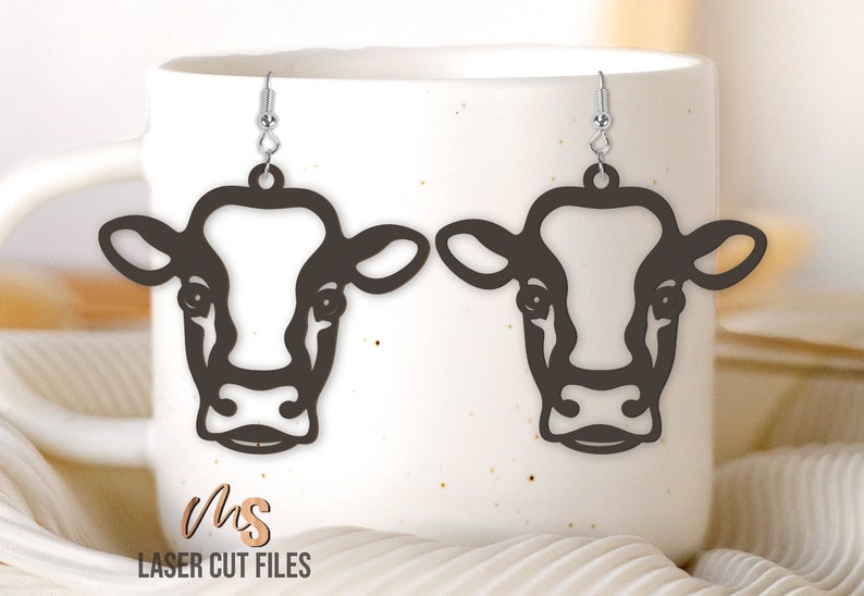 SVG Laser Cut Files for a pair of Cow Earrings. A cute cow head earring template perfect for making wood and acrylic farm animal and country earrings!