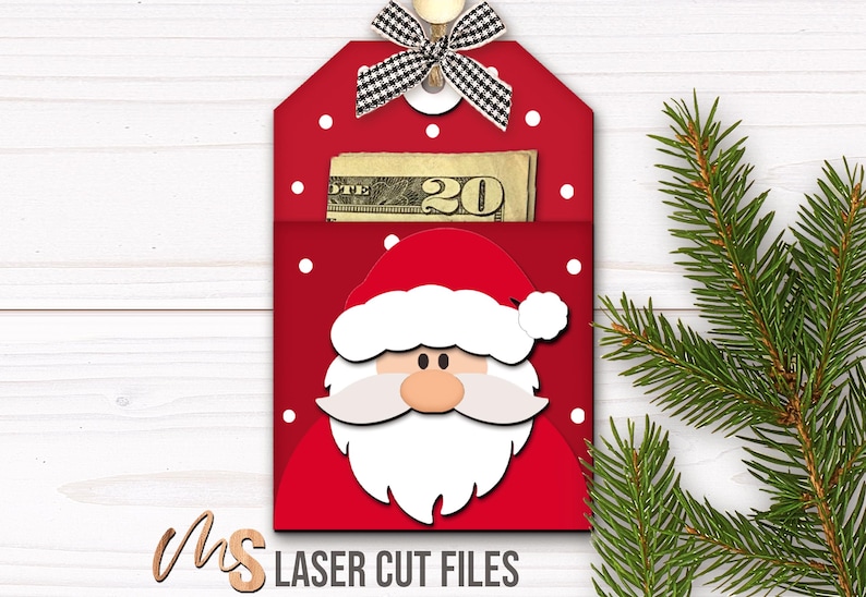 SVG Laser Cut Files for a bundle of 6 Christmas Gift Card Holders featuring cute Gift Tag shapes decorated with a Santa Claus, the text Ho Ho Ho, a Snowman, a Gingerbread Man, a Reindeer, and a Christmas Coffee Cup with spacers on the inside where you can insert your Gift Cards and money! Create festive Gift Card Holders, Money Holders, and gift Ornaments!