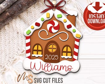 May include: A gingerbread house decoration with a red and white candy swirl, a chimney, and the year 2025. The name "Williams" is written in red script. The decoration has a red and white striped border and is topped with a red bow.