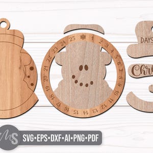 SVG Laser Cut Files for a Christmas Countdown Snowman Ornament featuring a cute snowman wearing a scarf and top hat adorned with a snowflake. His scarf covers a round turning wheel with 25 numbered days until Christmas, and his hat provides a window at the top to show how many days you have left! Turn the wheel each day until you reach the snowflake on Christmas morning!