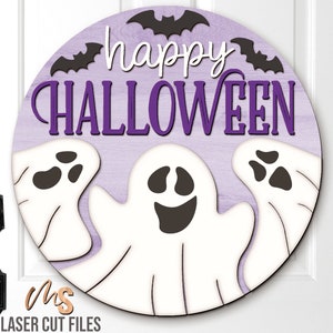 SVG files for a round wood Halloween Sign with three spooky ghosts peaking up from the bottom with the phrase Happy Halloween in decorative fonts and bats flying overhead. Perfect for making spooky Halloween Door Hangers, Ghost Signs, and Halloween decor this fall season!