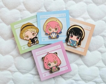 May include: Four enamel pins featuring cartoon characters with different coloured hair and outfits. Each pin is set against a pink, blue or yellow background with a white border and the text "Daily Hudos" in black.