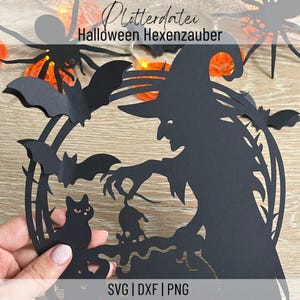 May include: Black paper cut-out of a witch with a pointed hat, bats, a cat, and a mouse. The text "Plotterdatei Halloween Hexenzauber" is at the top. The bottom of the image has the text "SVG | DXF | PNG".