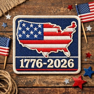May include: A rectangular patch with the US flag design in the shape of the country's outline. The patch has a blue background with the text "1776-2026" in white. The image includes miniature American flags and star-shaped decorations.
