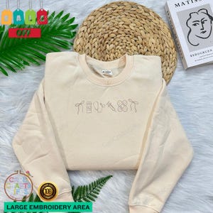 Sweat-shirt brodé avec emblème d'infirmière - Joli col rond d'infirmière avec icônes médicales - Cadeau attentionné pour les infirmières et les étudiantes en soins infirmiers