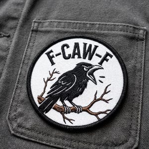 May include: A set of three ceramic mugs with a speckled, matte finish. The mugs are in shades of cream, light gray, and dark gray. Each mug has a simple, minimalist design and a rounded handle.