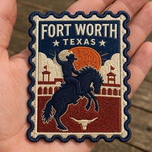 May include: Embroidered patch in a postage stamp design featuring a cowboy riding a bucking bronco. The patch reads "FORT WORTH TEXAS" in white lettering against a navy blue background, with a red and orange sunset and a longhorn skull.