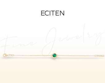 Pulsera de oro macizo de 14k con esmeralda, solitario engastado en bisel, joyería delicada.
