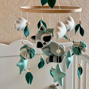 Baby mobile. Mobile for girls and boys. A raccoon on the moon. First toy.