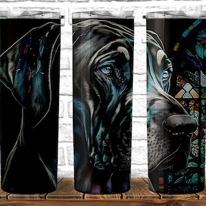 May include: A stainless steel tumbler with a black background and a colorful illustration of a Great Dane's head. The dog's eyes are blue and the illustration has a stained glass effect.