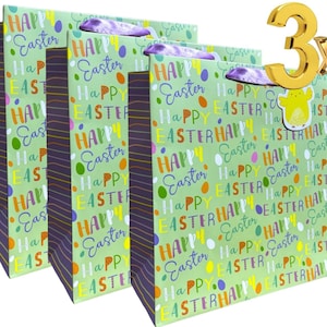 May include: Three green and purple gift bags with a repeating pattern of colourful Easter eggs and the text "Happy Easter". The bags are decorated with purple ribbon handles.