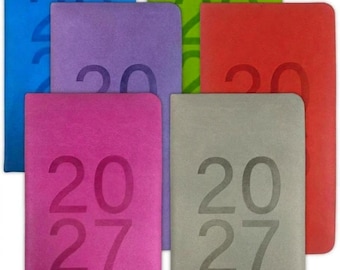 May include: A collection of six rectangular planners in blue, green, purple, red, pink, and gray. Each planner features the year 2027 embossed in a large, bold font on the front cover. The planners have rounded corners and a smooth finish.