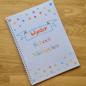 A single example of personalised school memory books with name in orange