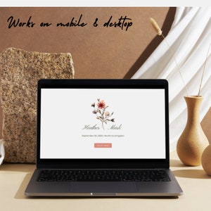 May include: A laptop computer screen displaying a wedding website with a floral illustration and the text "Heather Mark" and "September 20, 2025 | North Huntingdon". The website also includes a button that says "RSVP HERE".