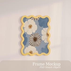 May include: A rectangular wall frame with a wavy, yellow border containing a floral print. The artwork features white and brown striped flowers against a light blue background with solid blue shapes. The text "Frame Mockup PSD Smart Object" is visible.