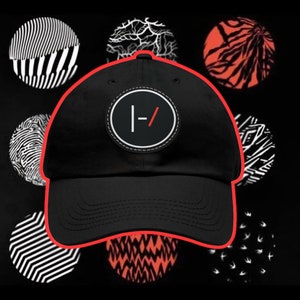 May include: Black baseball cap with a circular patch featuring a white and red graphic. The cap is surrounded by various circular designs in black, white, and red. The hat is a classic style, suitable for casual wear.