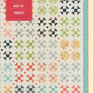 May include: A quilt pattern featuring a variety of colorful fabrics in a geometric design. The pattern is called "Parfait" and is from Moda Fabrics. The pattern number is MOD 139.