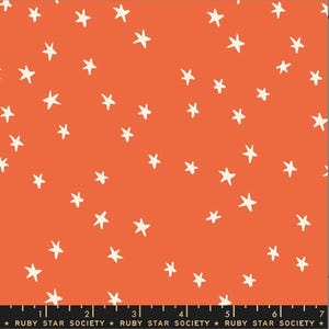 May include: Orange fabric with a scattered pattern of off-white stars. The fabric has a smooth texture and is suitable for various sewing projects. The bottom of the fabric has the text "RUBY STAR SOCIETY".