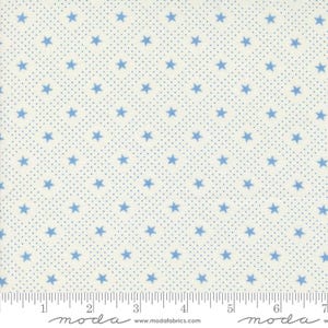 May include: White fabric with a blue star pattern. The stars are arranged in a diagonal pattern and are surrounded by tiny blue dots.