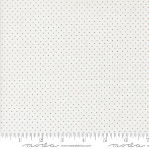 May include: White fabric with a repeating pattern of small, evenly spaced tan dots. The fabric has a ruler printed along the bottom edge, with the word "moda" and the website address www.modafabrics.com.