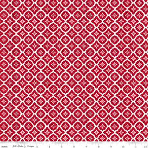 May include: Red and white patterned fabric with a repeating floral design. The fabric has a symmetrical pattern of red quatrefoils with white accents. The image includes a ruler in inches and the text "Riley Blake Designs".