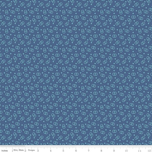 May include: Blue fabric with a repeating pattern of interlocking circles and small dots in a lighter shade of blue. The fabric is marked with inches and the text "Riley Blake Designs".