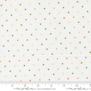 May include: White fabric with a repeating pattern of colorful polka dots in shades of pink, green, blue, and orange. The fabric has a ruler printed along the bottom edge, with markings in inches.