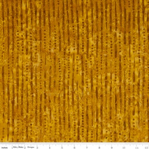 May include: A yellow fabric with a repeating pattern of vertical lines and small dots. The fabric has a batik style design.