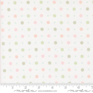 May include: White fabric with a repeating pattern of small green, pink, and peach circles. The fabric has a subtle texture and is marked with a ruler in inches.