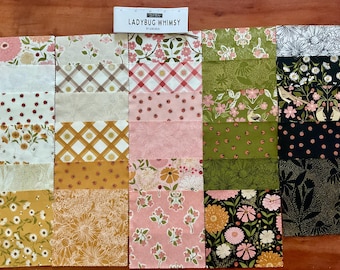 May include: A collection of fabric squares labeled Ladybug Whimsy by Riley Blake, featuring various floral, plaid, and ladybug patterns in shades of pink, green, yellow, black, and white, arranged in a grid with a ruler showing 5 inches.