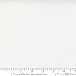 May include: Off-white fabric with a subtle texture. A ruler is at the bottom of the image, with the word "moda" and the website address "www.modafabrics.com" printed on it.