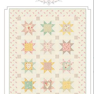 May include: A patchwork quilt with a repeating star pattern in pastel colors. The stars are made of floral and patterned fabrics in shades of pink, yellow, and green. The quilt is bordered with a floral print and the text "Sweet Surprise".