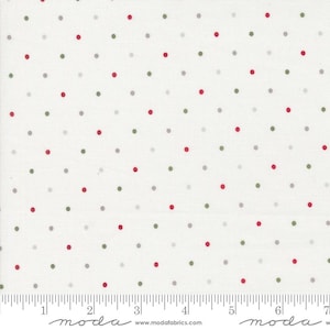 May include: White fabric with a repeating pattern of red, green, and gray polka dots. The dots are evenly spaced across the surface. The fabric has a ruler printed along the bottom edge, with the word "moda" printed at the bottom.