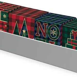 May include: A display of Christmas-themed gift boxes with plaid patterns in red, green, and blue. The boxes feature festive designs like a Christmas tree, snowflakes, and the word "NO". One box reads "MERRY QUILTING".
