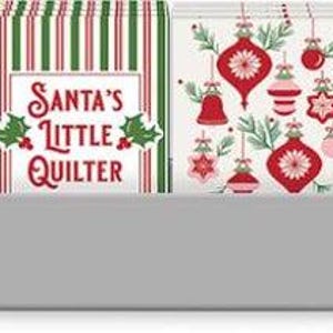 May include: A collection of Christmas-themed paper napkins in a gray rectangular holder. The napkins feature various designs, including poinsettias, ornaments, and the phrases "Sew Merry" and "Santa's Little Quilter". The color palette includes red, green, and white.