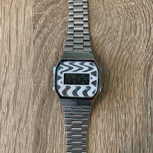 Casio A168 - Cadran personnalisé : Warp (carte Pokémon holographique/blanc)